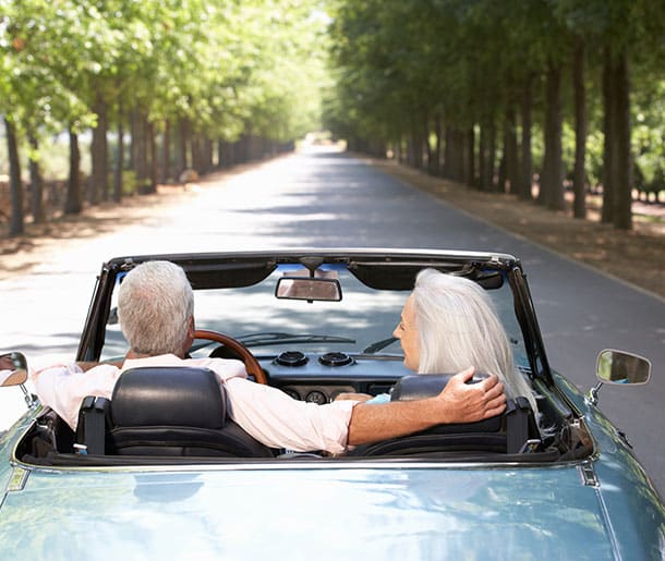 old-couple-driving-a-convertible